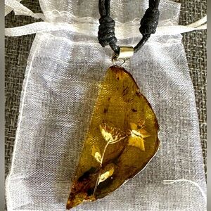 Amber Carved Flower Butterfly Blue Florescence Pendant Black Cord Necklace